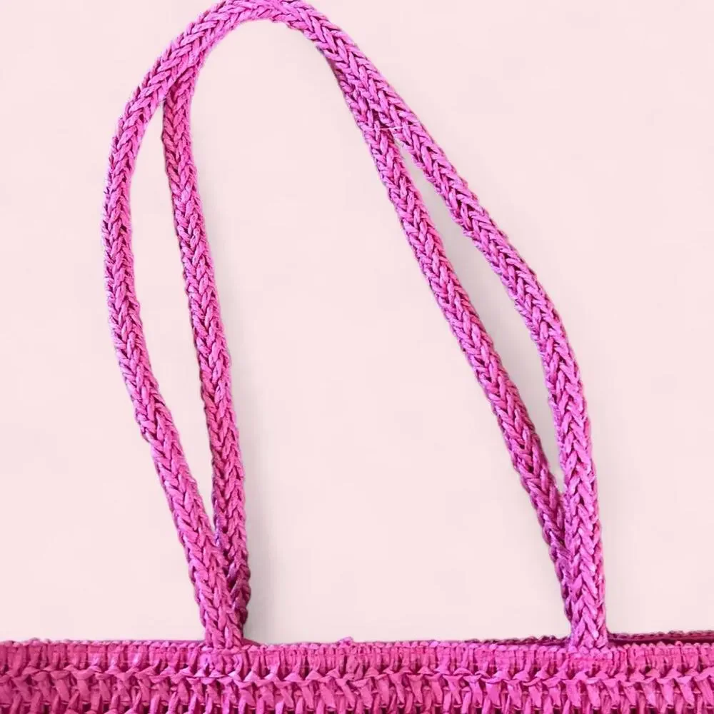Pink Juicy Couture woven tote bag with braided handles